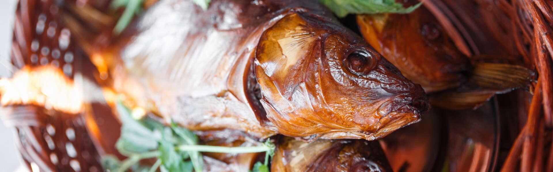 Smoked Zatorski carp arranged in a wicker basket